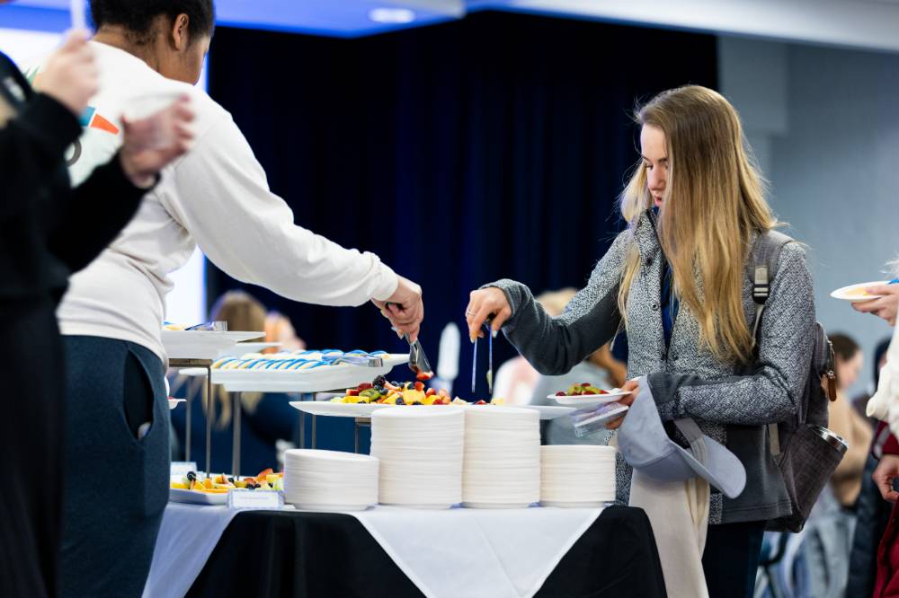 Students get fruit from buffet